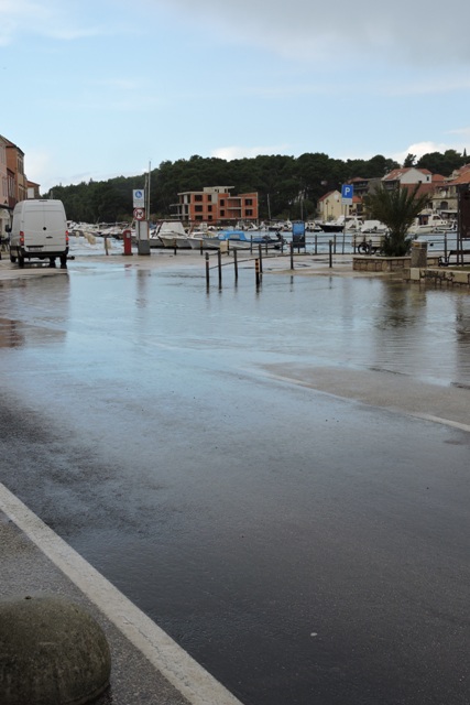Sea water covers the road in central Stari Grad.