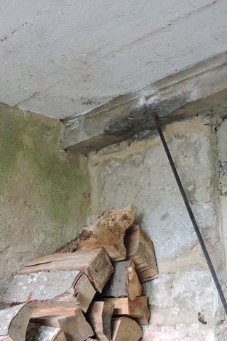The still damp corner under the bridge
