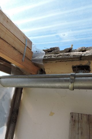 The guttering is not catching the rain from the roof