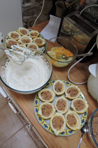 Lemons split, biscuits crumbled and cream mixed